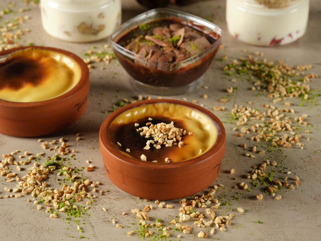 Delicious traditional Turkish sütlaç topped with nuts, perfect for dessert lovers.