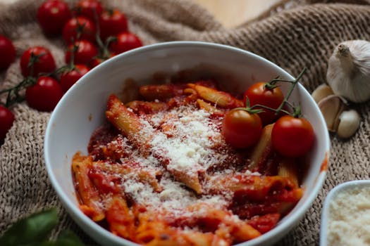 Tasty penne pasta in a rich tomato sauce, topped with parmesan cheese.